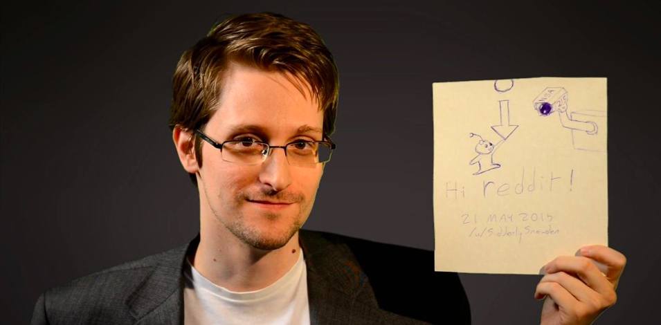 Photo of Edward Snowden holding paper